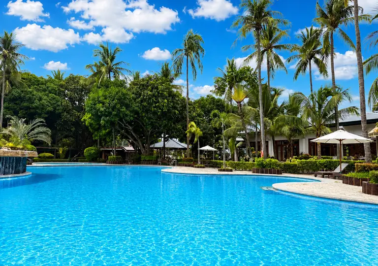 Serenity Pool and its tropical garden setting at Batangas Country Club.